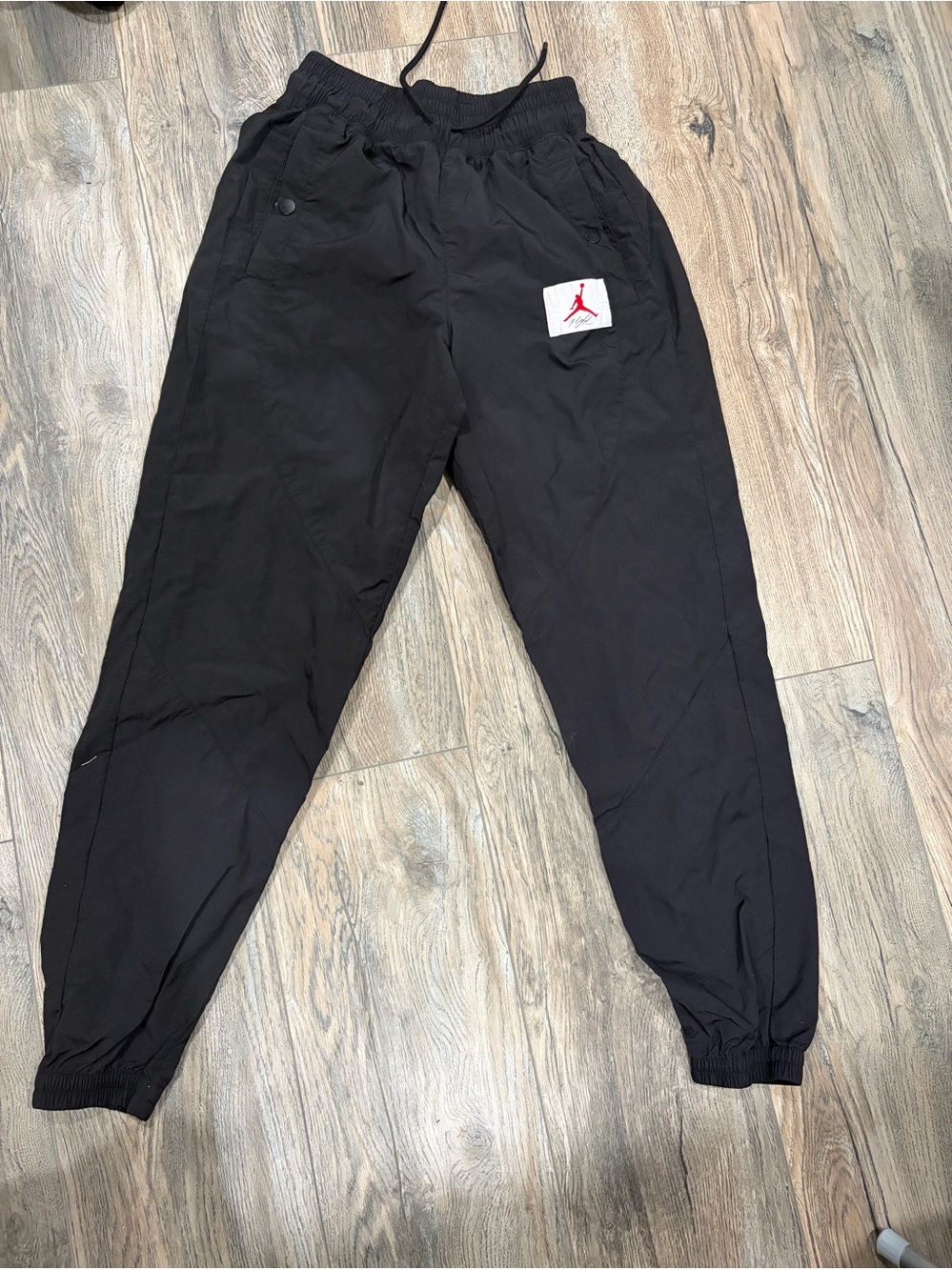 Jordan Black women’s Woven Jogger Pants with Red Jumpman Patch